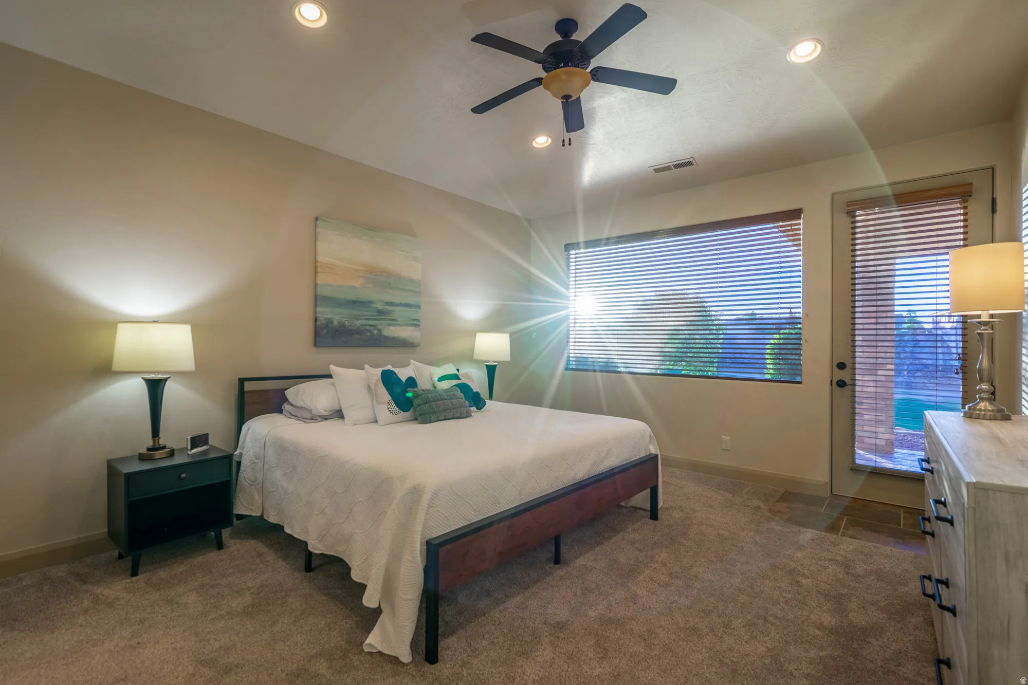 Bedroom with dark carpet, a ceiling fan, and recessed lighting