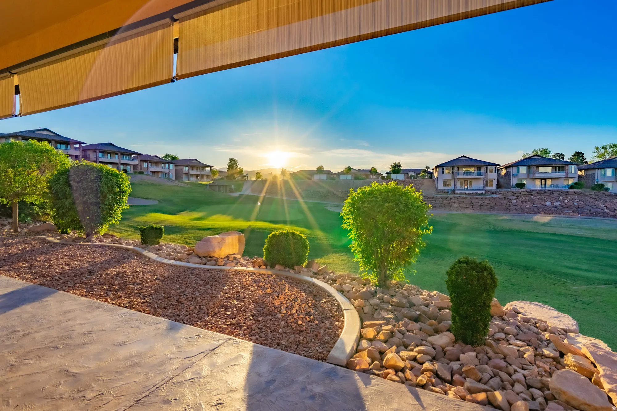 View of green lawn featuring a residential view