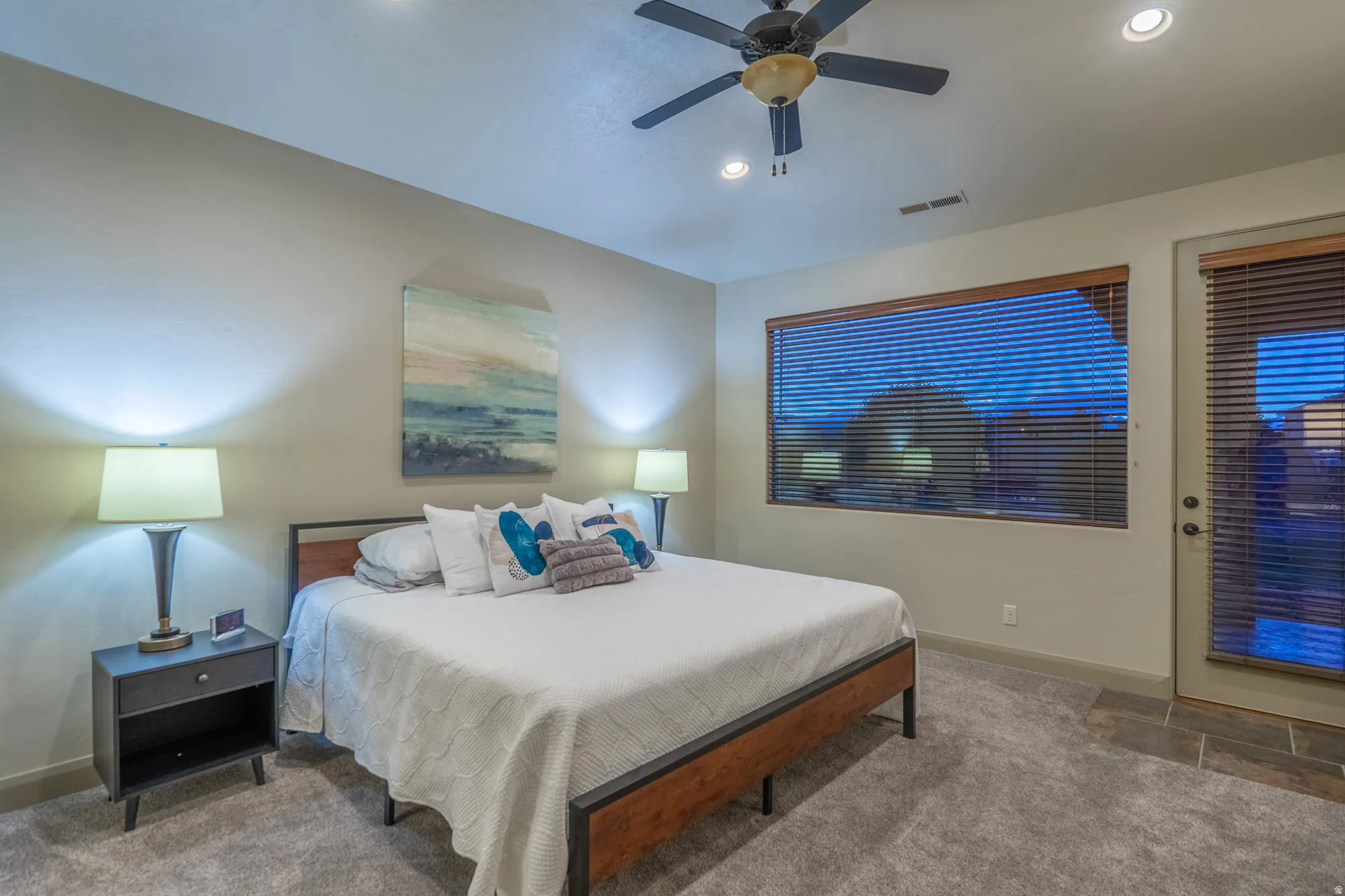 Bedroom featuring ceiling fan, carpet, and access to outside