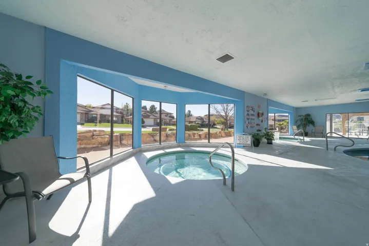 View of pool with a swimming pool and a residential view