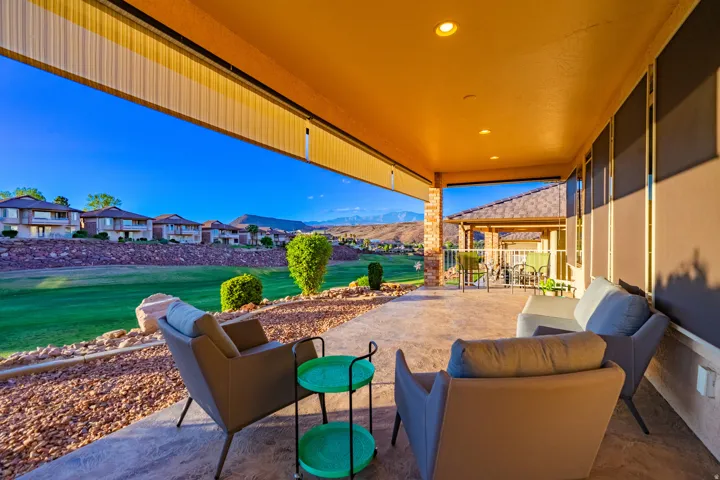 View of patio with a residential view, outdoor seating, and a mountain view