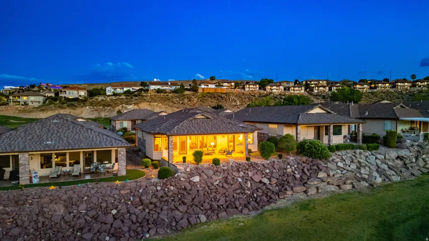 Back of house with a patio and a residential view