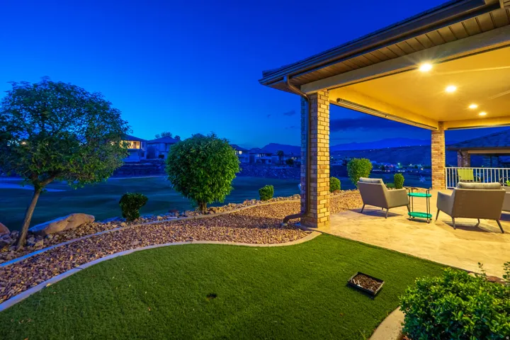 View of grassy yard with a patio