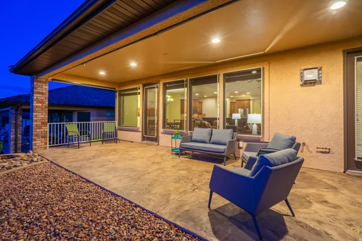 Patio at night featuring a patio and an outdoor hangout area