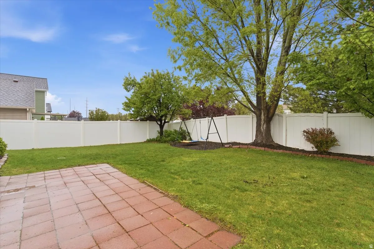 Fenced backyard featuring a patio area