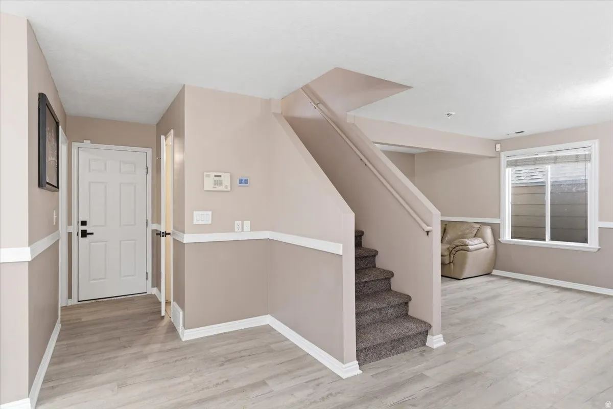 Stairway with wood finished floors