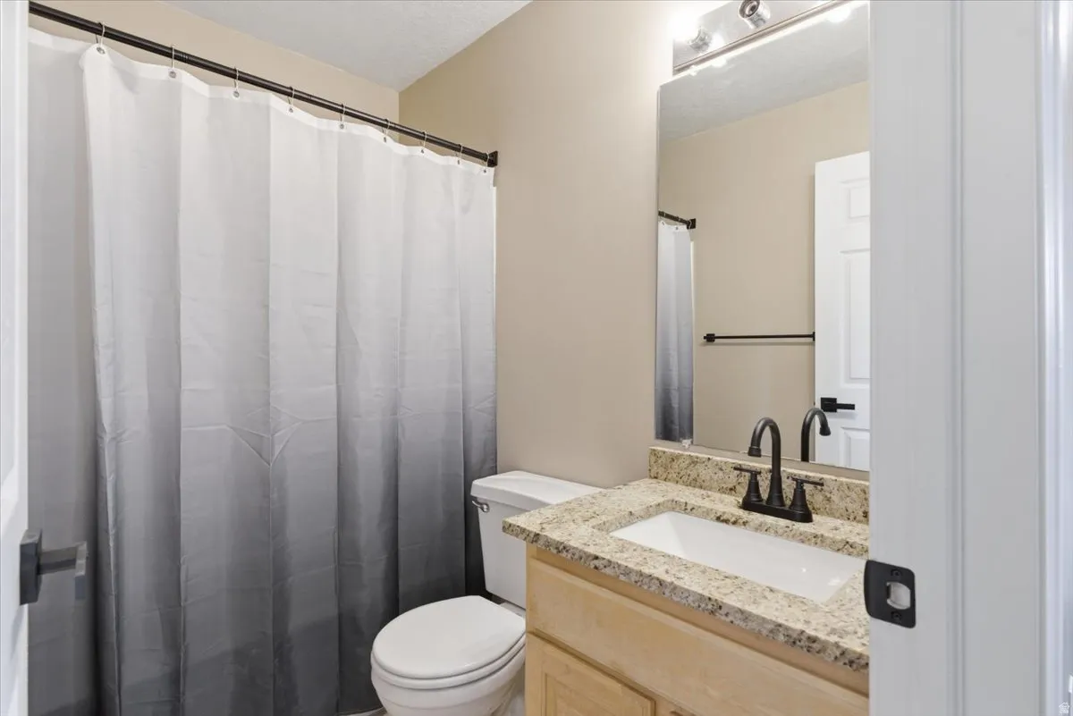 Bathroom featuring vanity and a shower with curtain