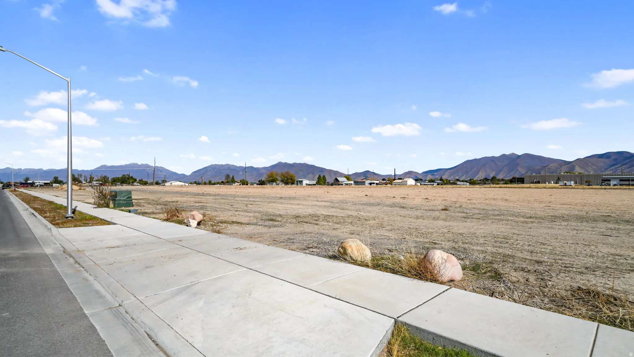 View of mountain background featuring rural landscape