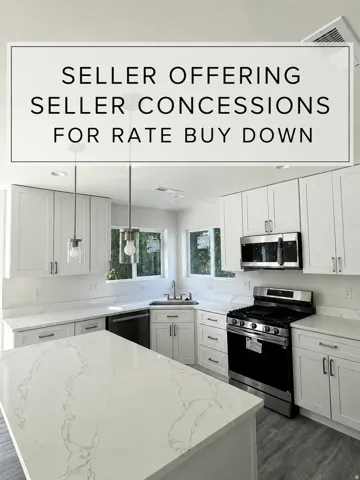 Bright kitchen featuring a central island, white cabinetry, integrated stainless steel appliances, light-toned countertops with veining, and pendant lighting