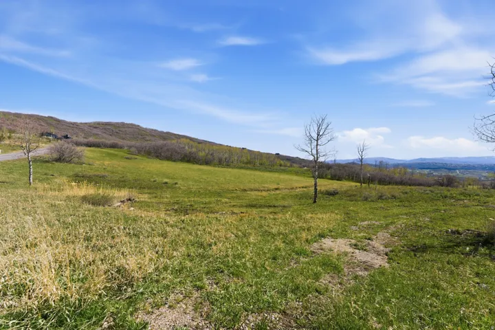 View of mountain background featuring rural landscape