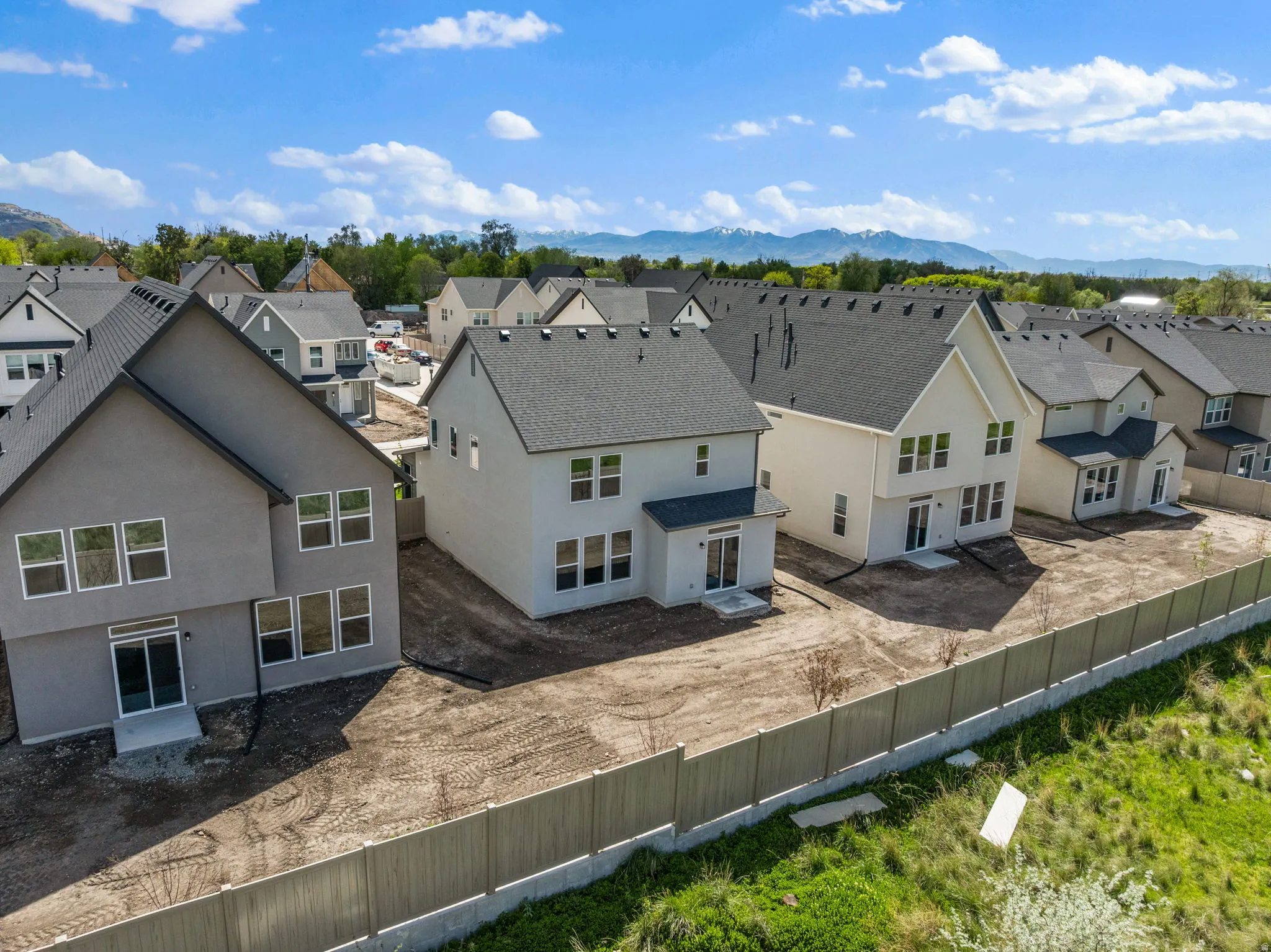 Aerial view of residential area featuring a mountain backdrop
