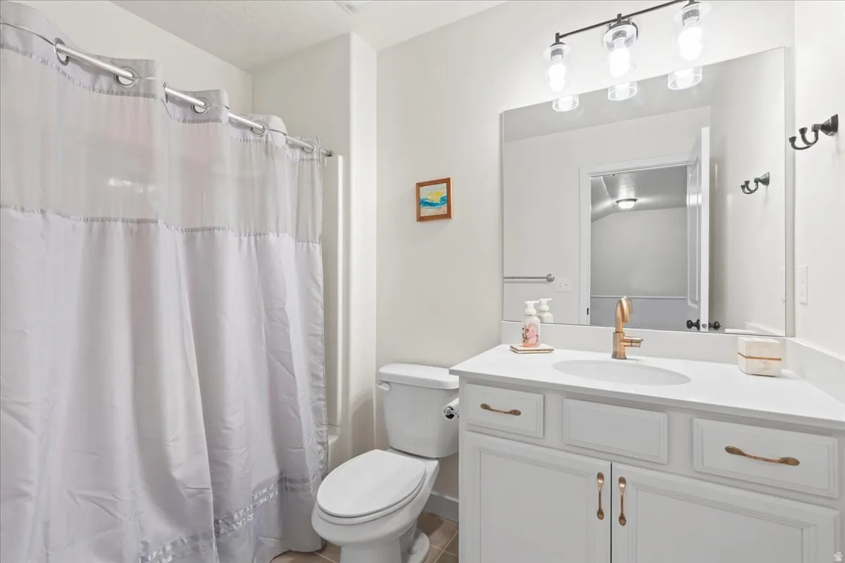 Bathroom featuring vanity and a shower with curtain
