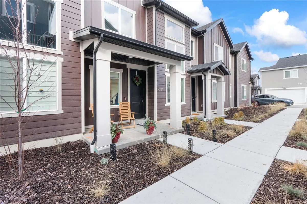 Property entrance featuring board and batten siding