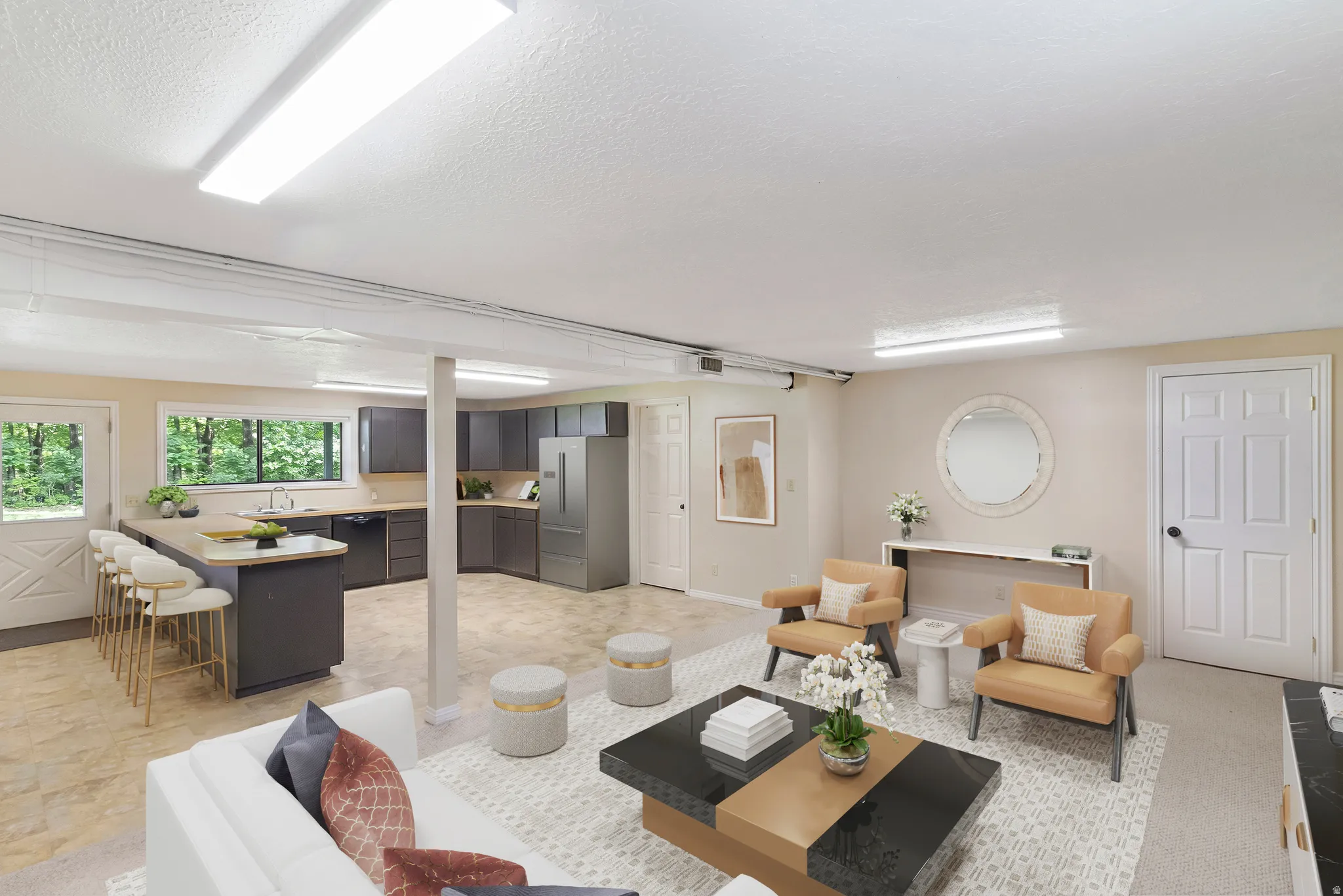 Living area featuring a textured ceiling and baseboards
