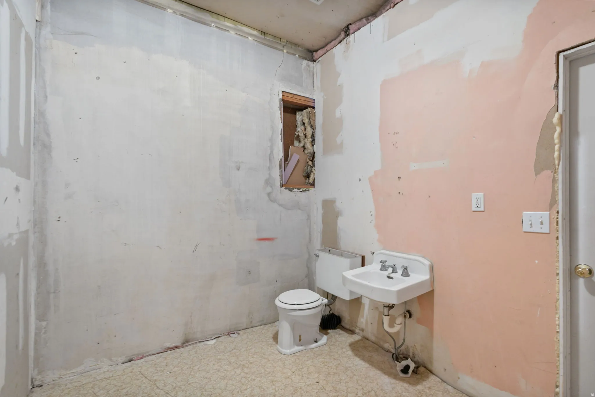 Bathroom featuring toilet and a sink