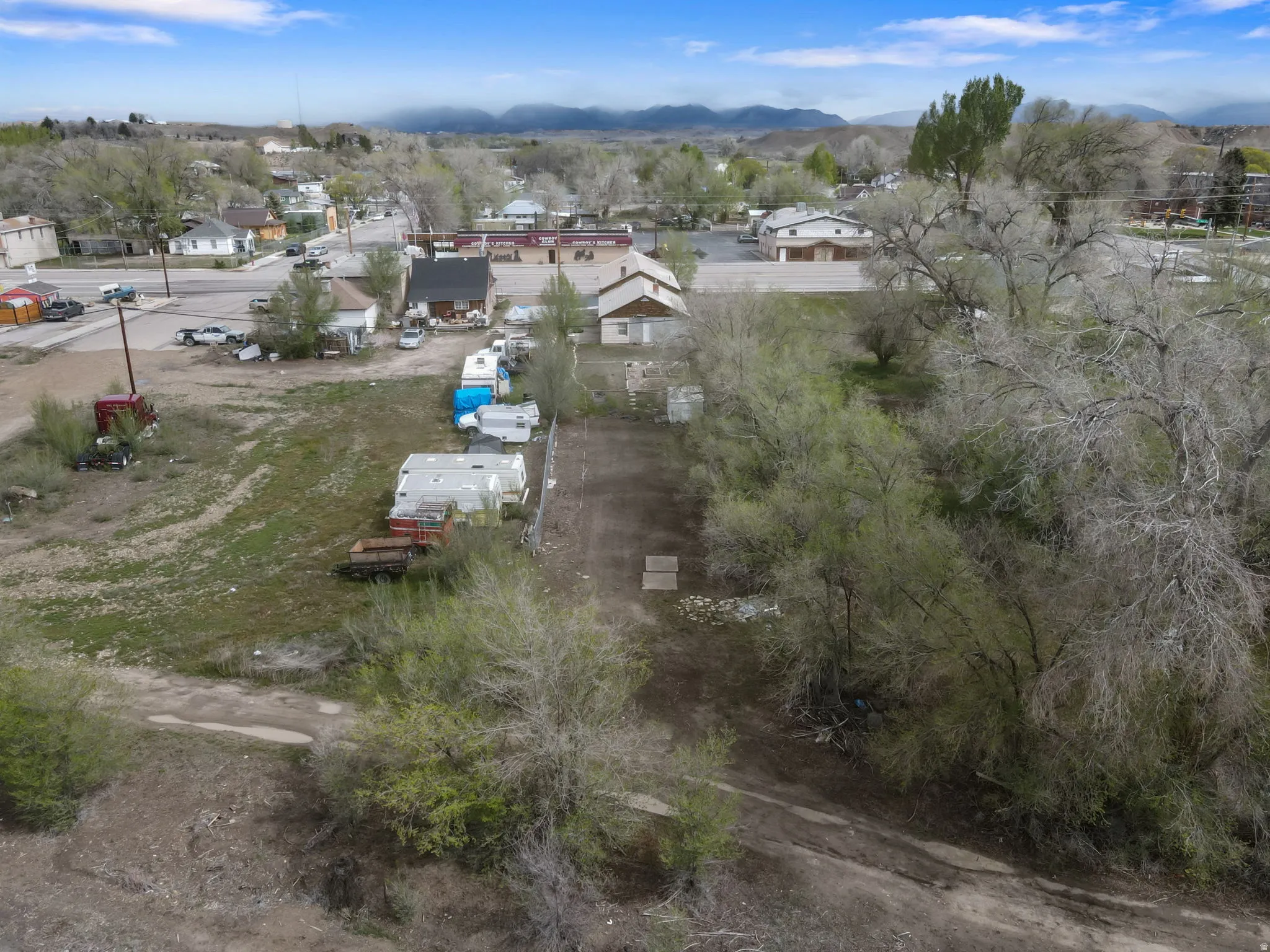 Aerial perspective of suburban area featuring a mountainous background
