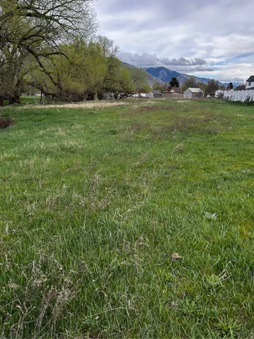 View of mountain backdrop with rural landscape