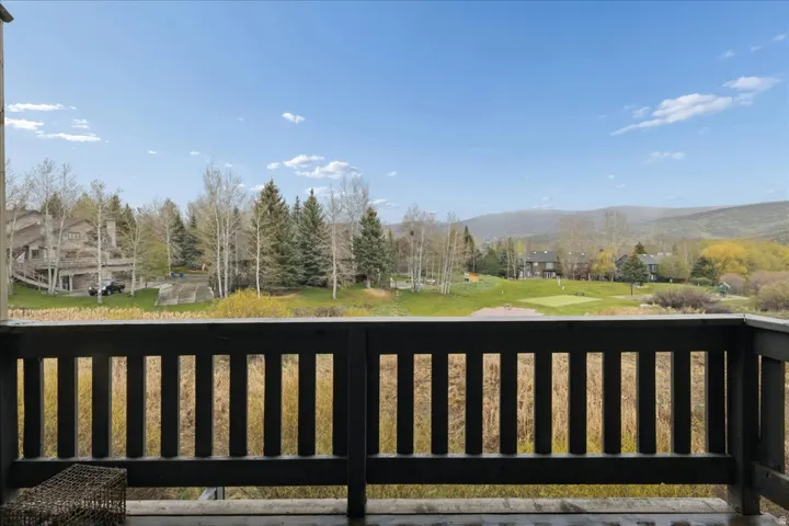 Wooden terrace featuring a mountain view