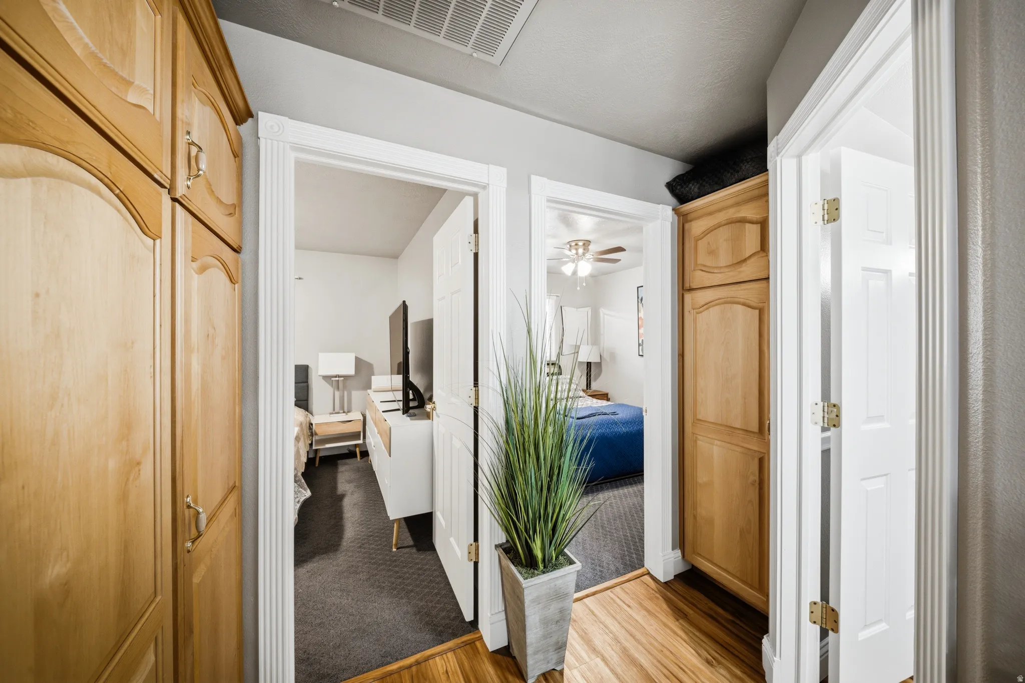 Hallway featuring light wood finished floors