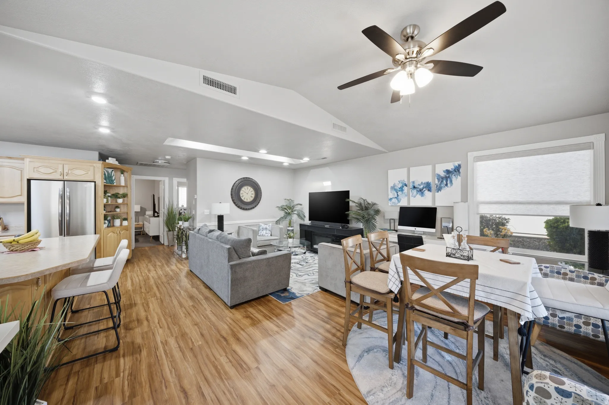 Dining room with light wood-type flooring and ceiling fan