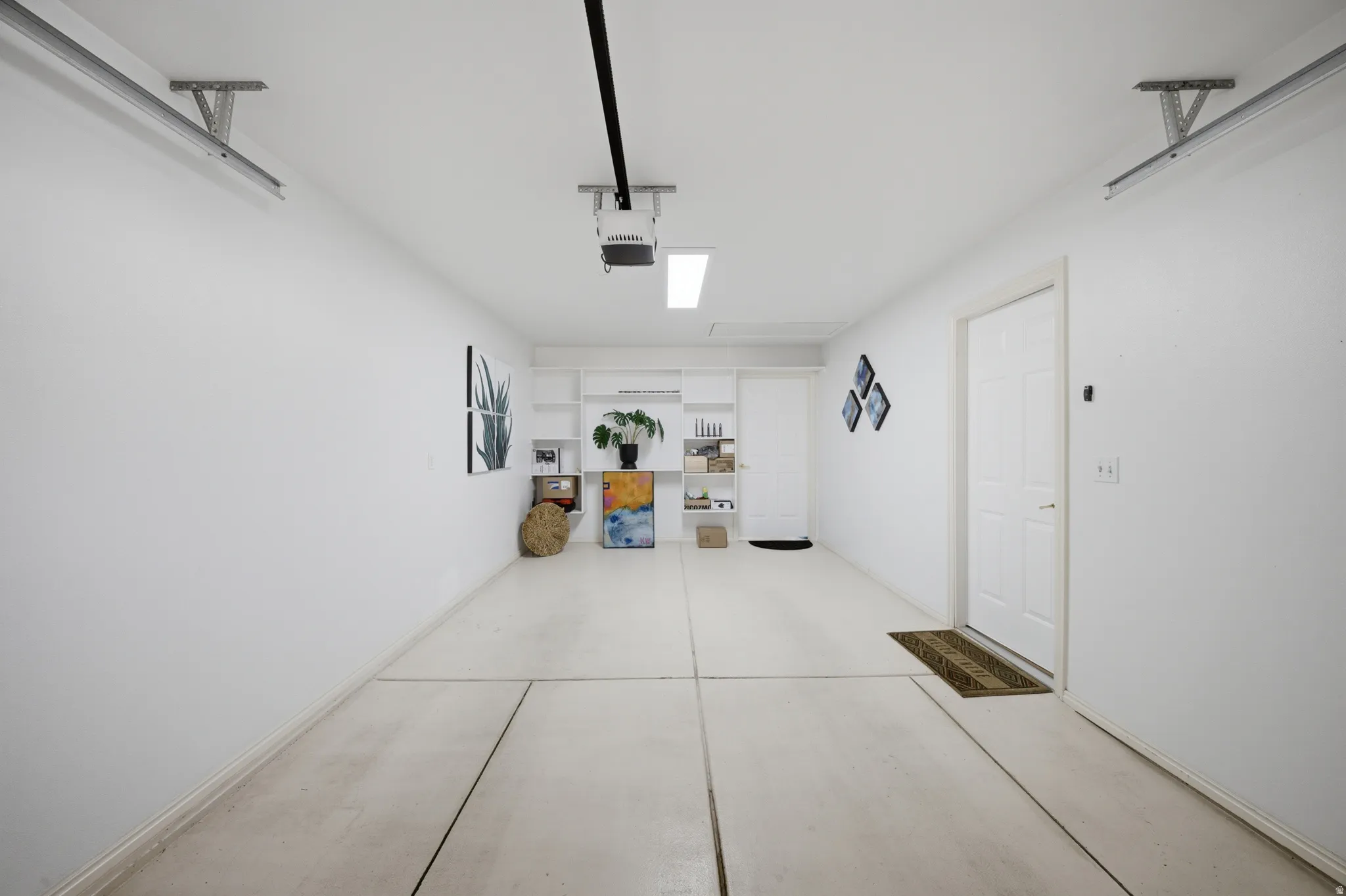 Garage featuring a garage door opener