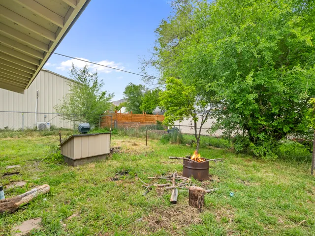 View of yard with a fire pit