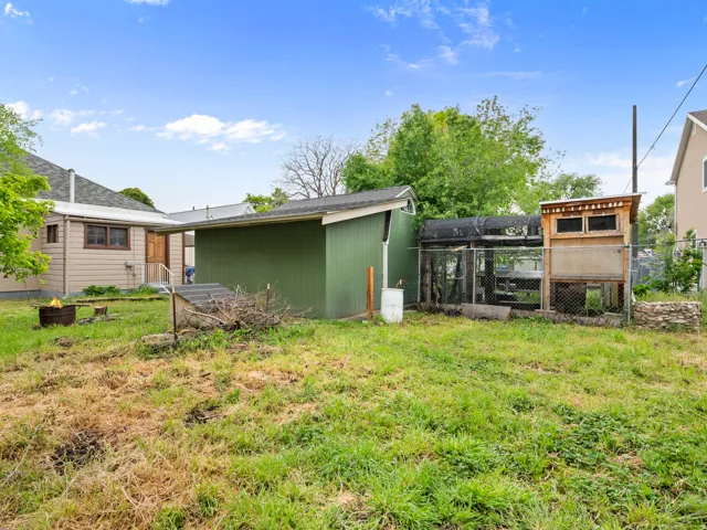 View of yard featuring an outbuilding and exterior structure