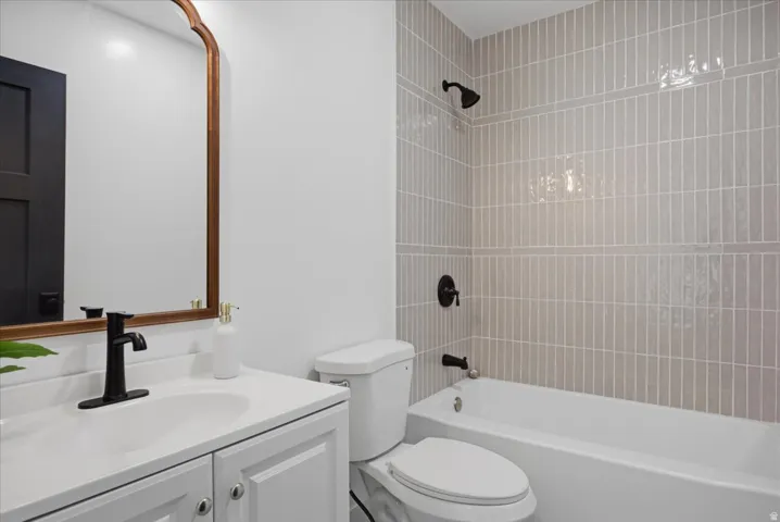 Bathroom with vanity and shower / bathtub combination