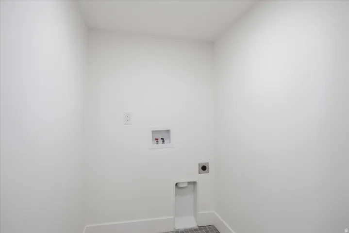 Laundry area with hookup for a washing machine and hookup for an electric dryer