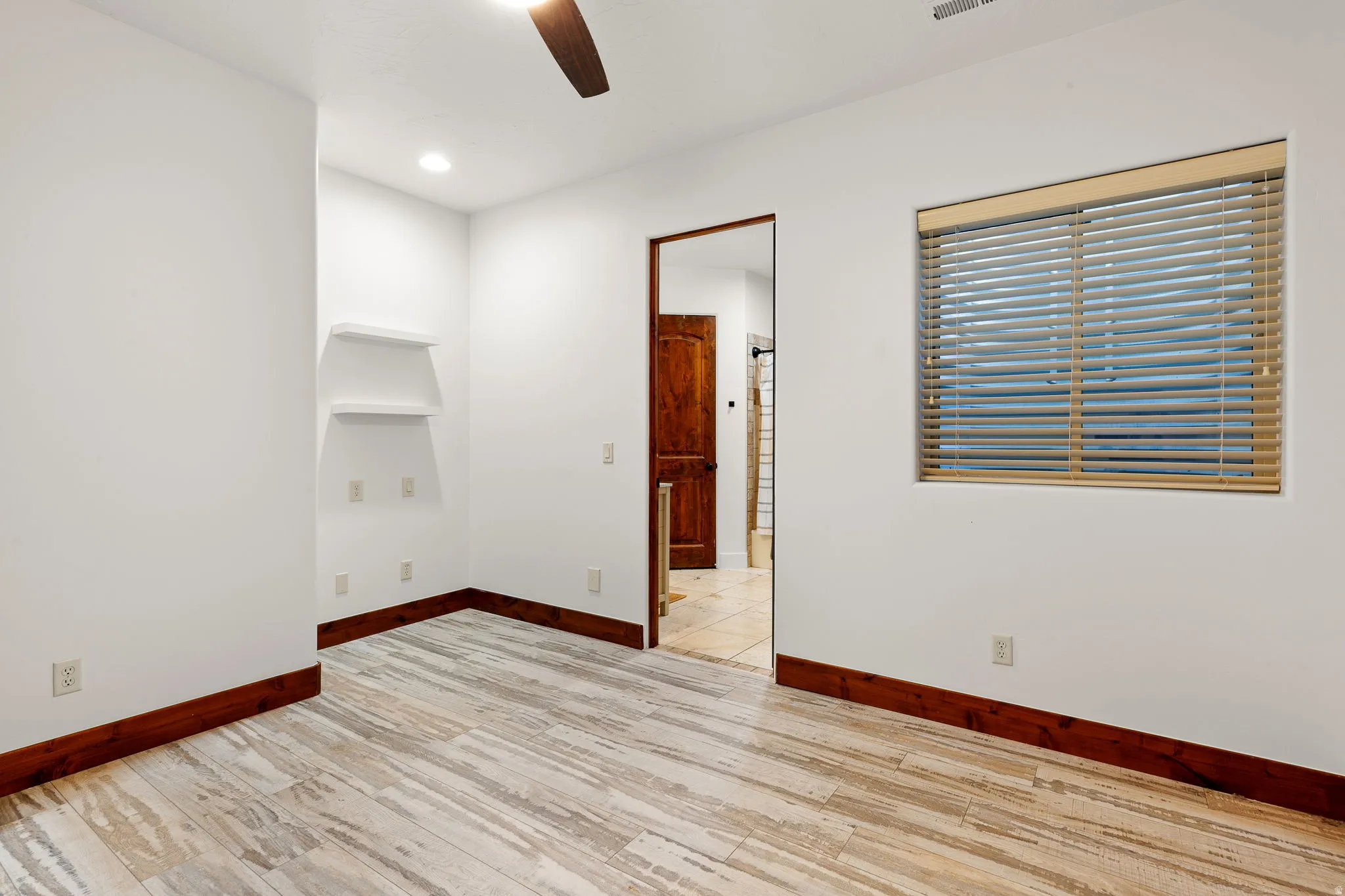 Empty room with light wood-style flooring, a ceiling fan, and recessed lighting