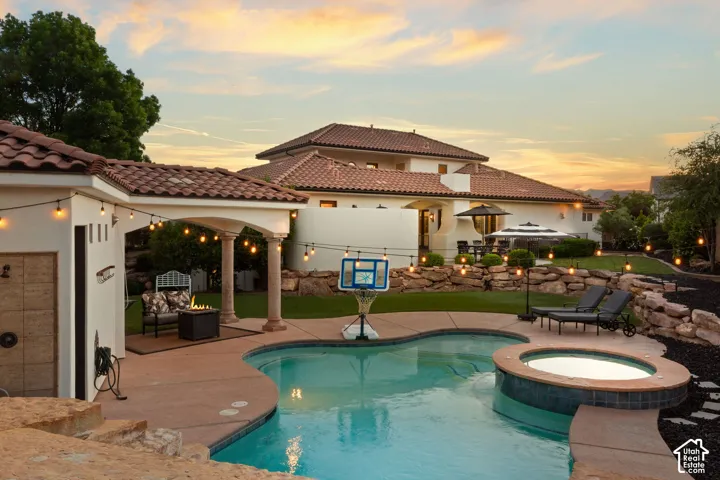 Integrated pool / spa featuring a patio
