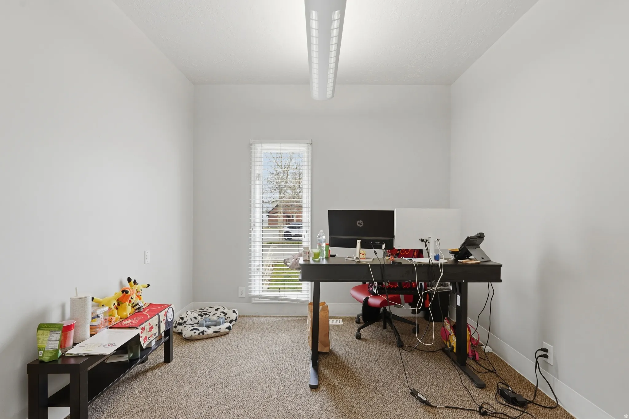 Office with light colored carpet