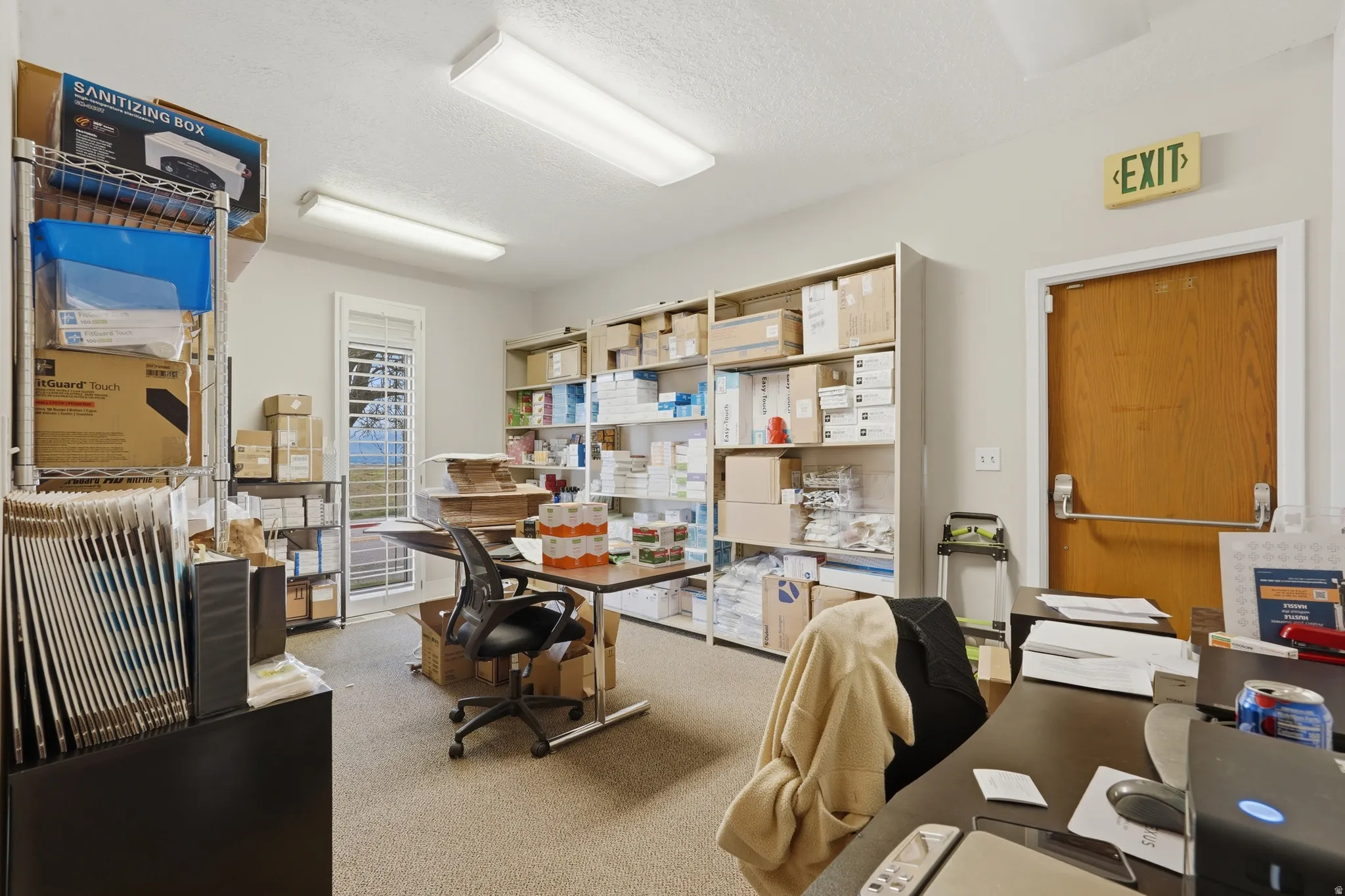 Office featuring a textured ceiling