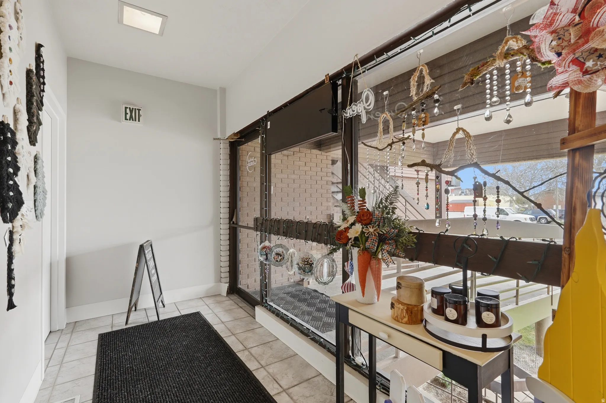 Interior space featuring light tile patterned flooring and baseboards