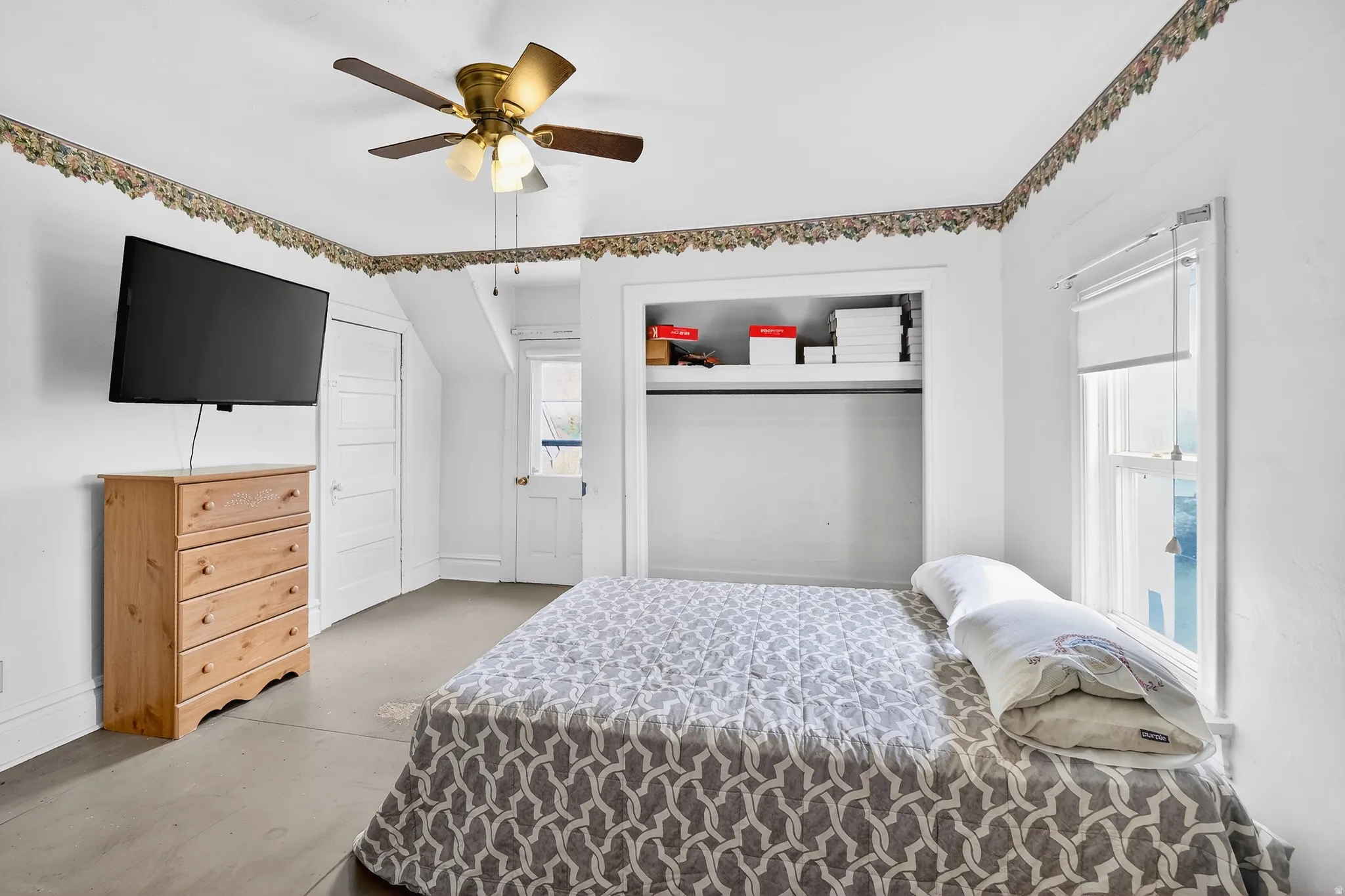 Bedroom with a closet and a ceiling fan