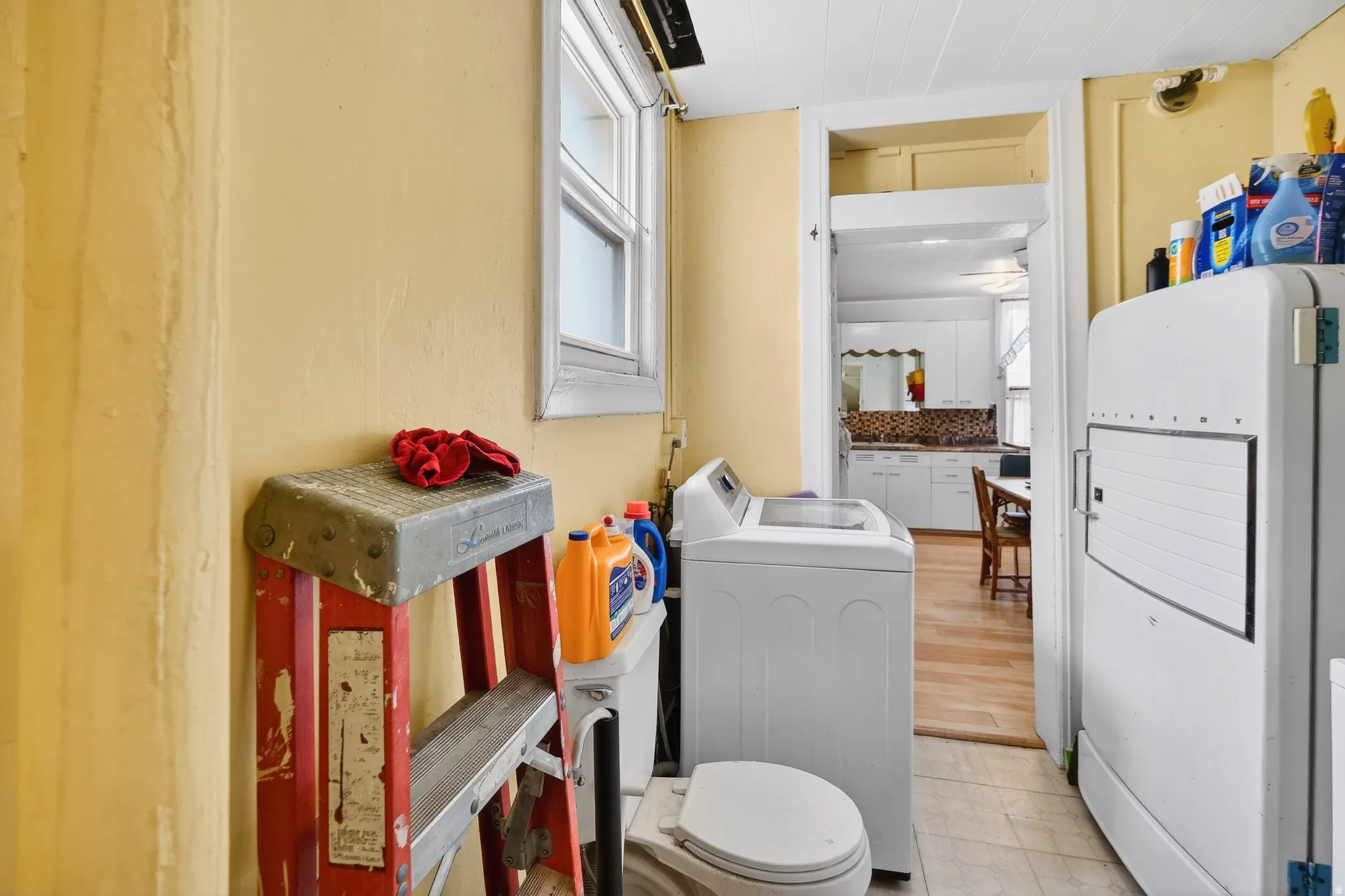 Bathroom featuring healthy amount of natural light and independent washer and dryer