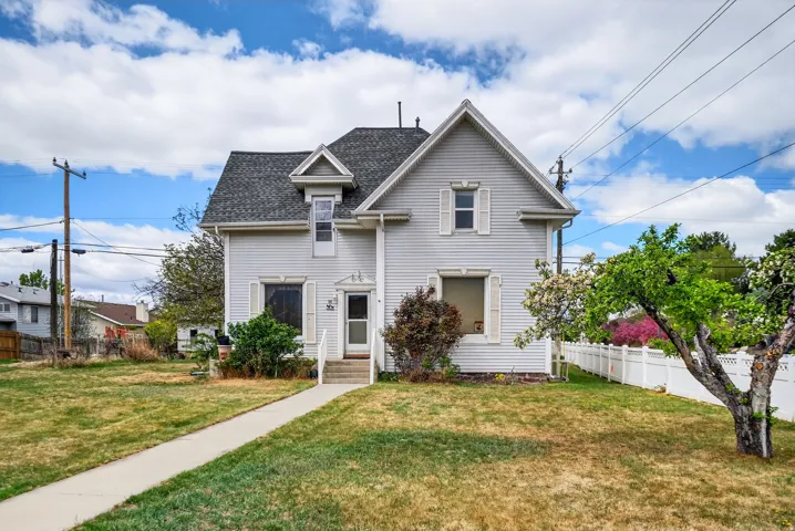 View of front of home featuring roof with shingles