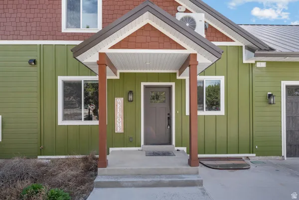 Doorway to property with board and batten siding