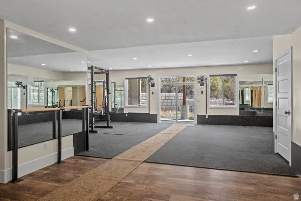 Gym with recessed lighting and a textured ceiling