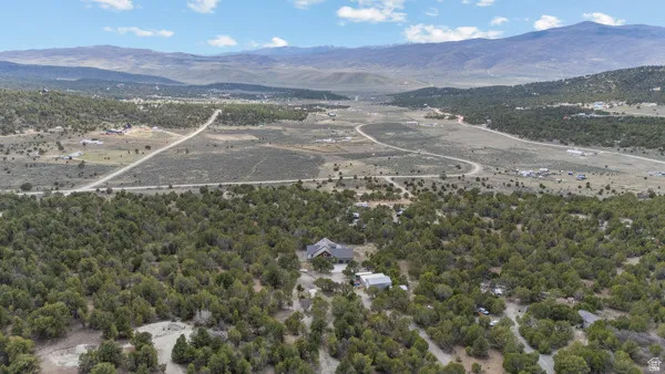 Bird's eye view of mountains and a heavily wooded area