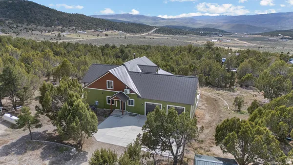 View from above of property with a mountainous background