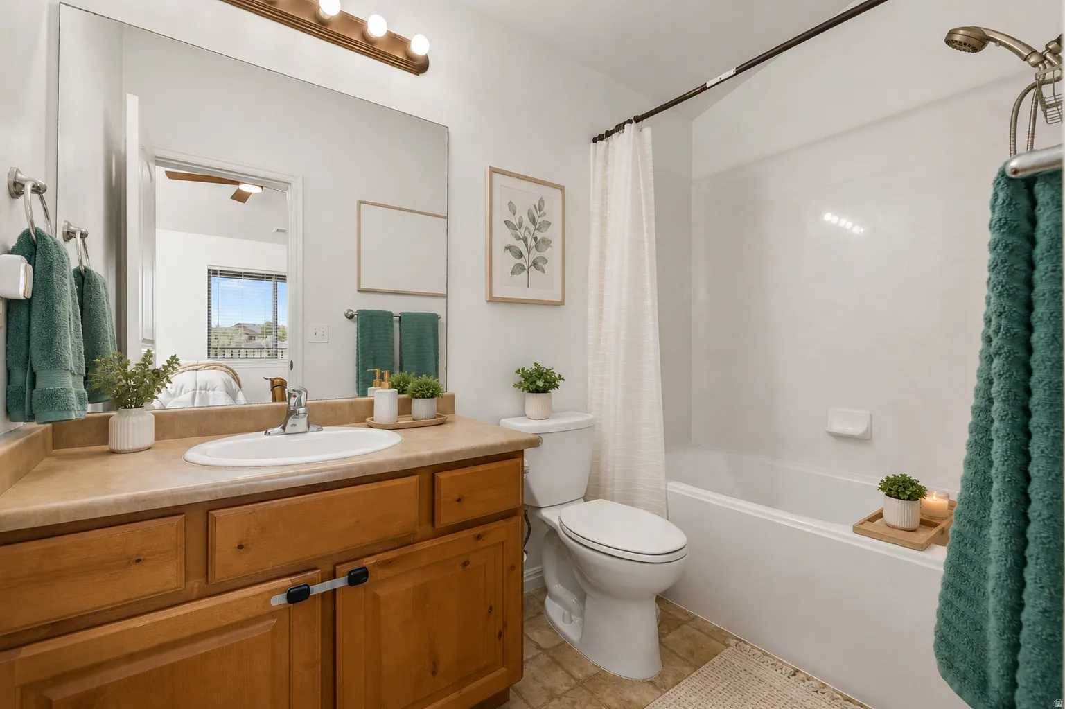 Spa-inspired bathroom featuring warm wood-finish cabinetry with ample storage, a wood countertop with integrated sink, and white subway tile surround