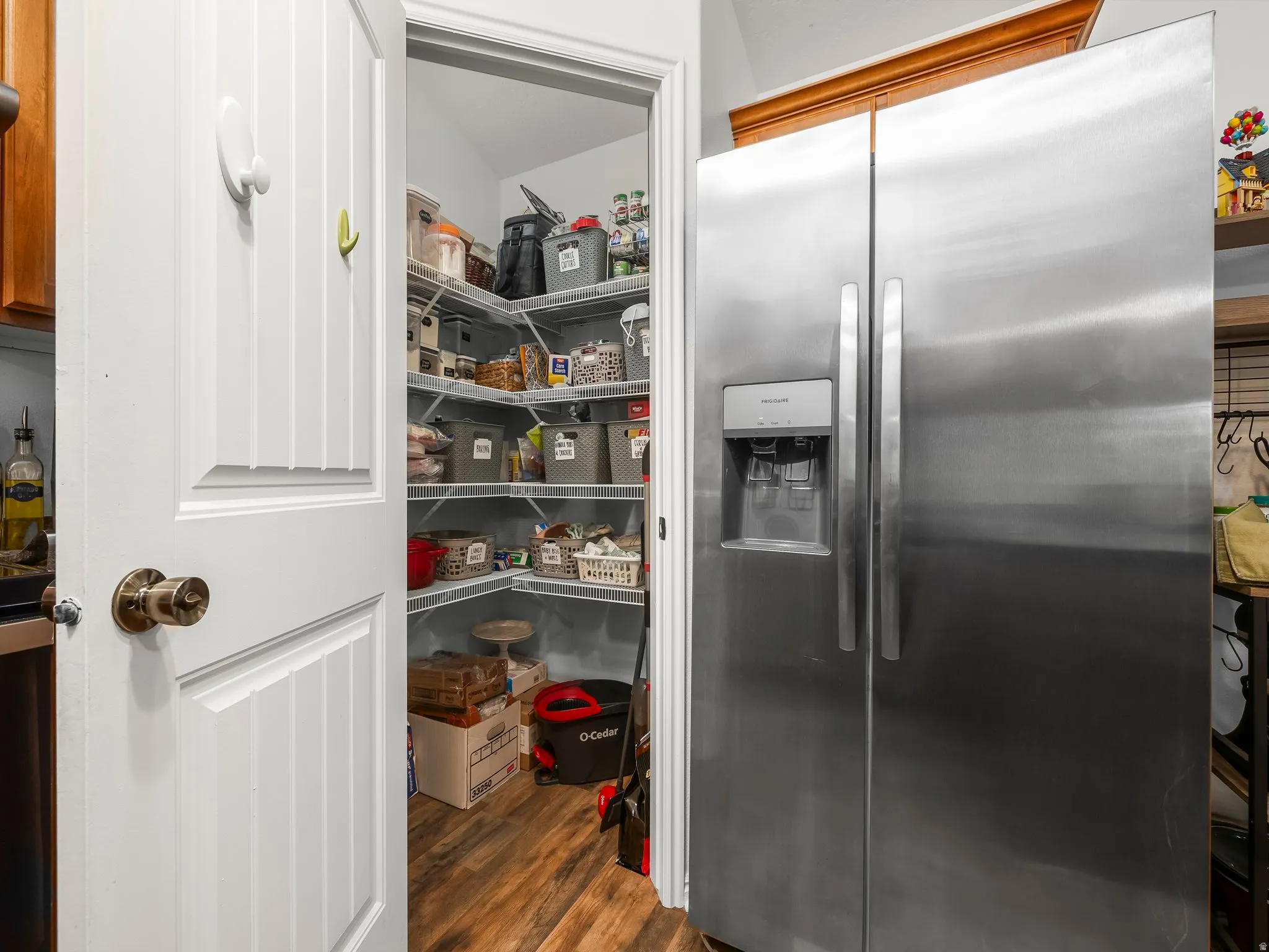 Very functional pantry and large Stainless Steel Fridge with water and ice dispenser.