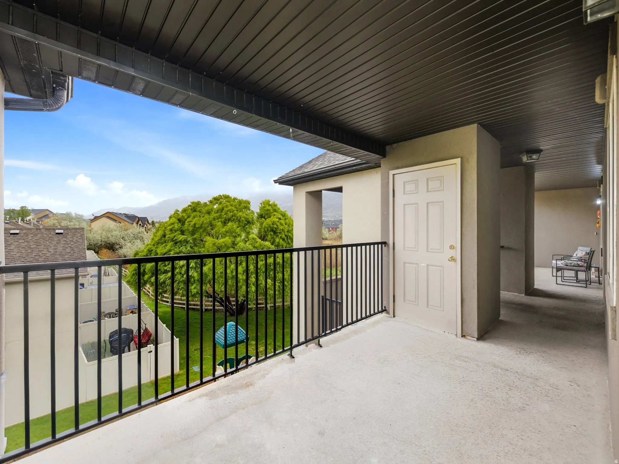 View of balcony and outdoor storage closet.