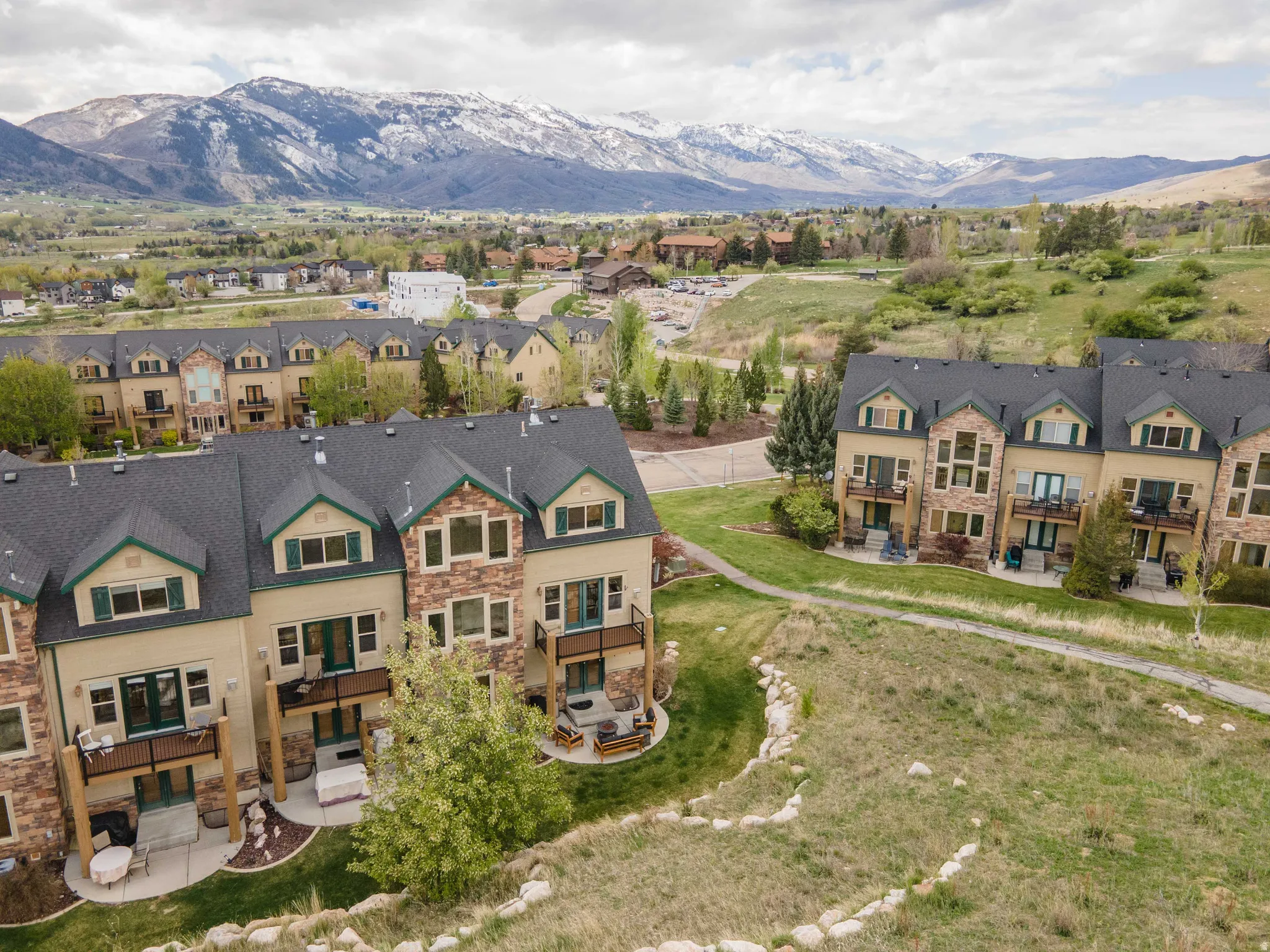 Aerial perspective of suburban area featuring a mountain backdrop
