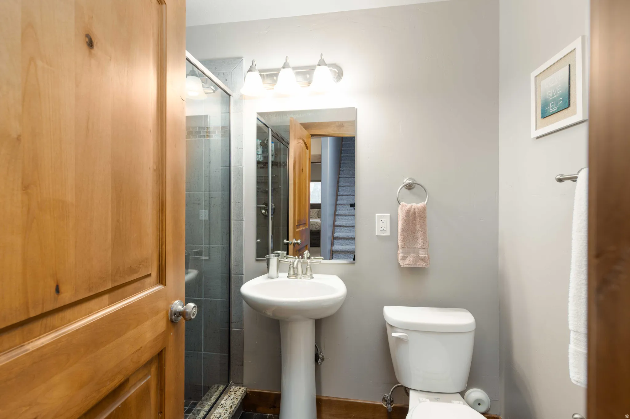 Bathroom with toilet and a shower stall