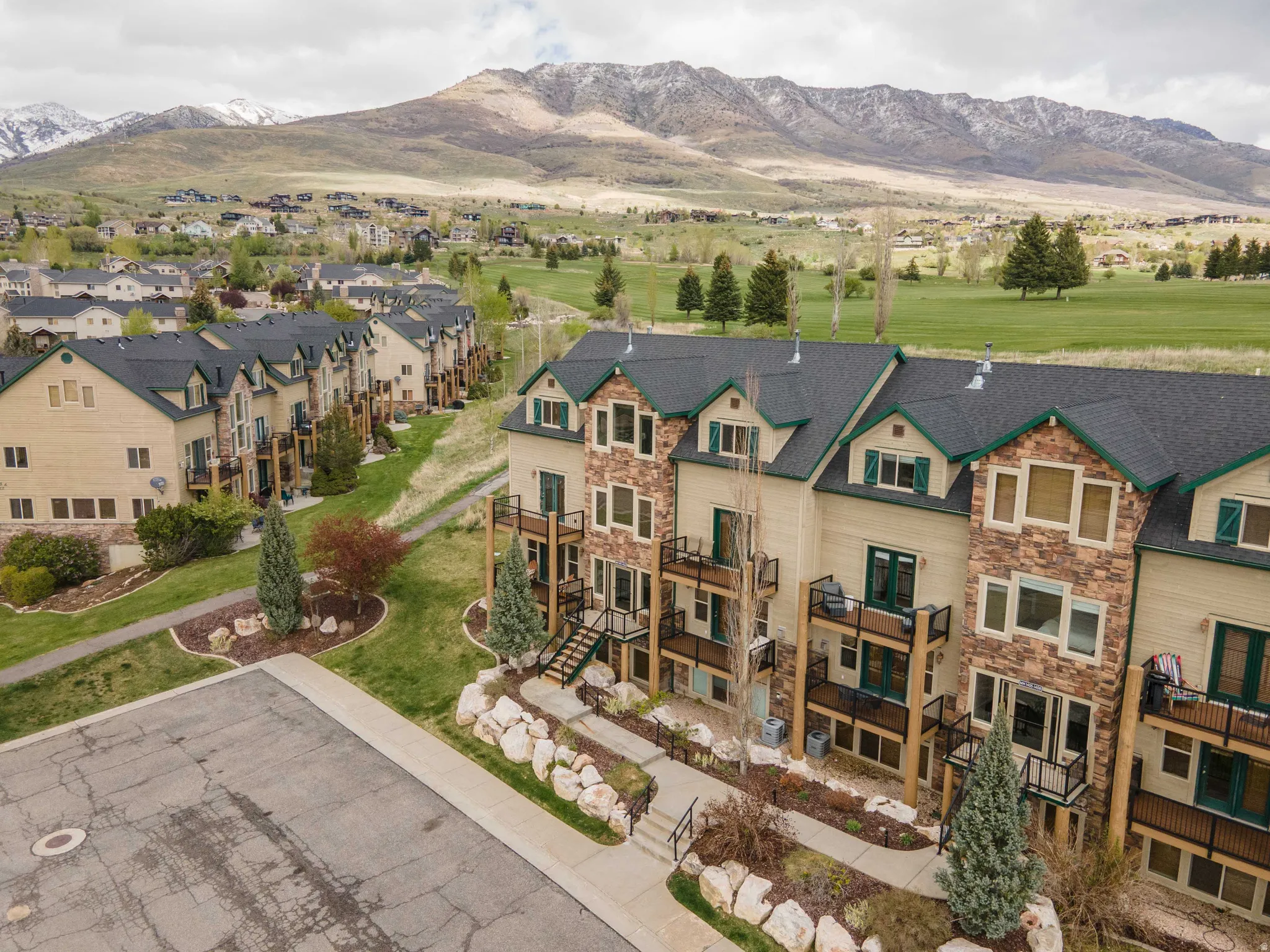 Aerial perspective of suburban area featuring a mountain backdrop