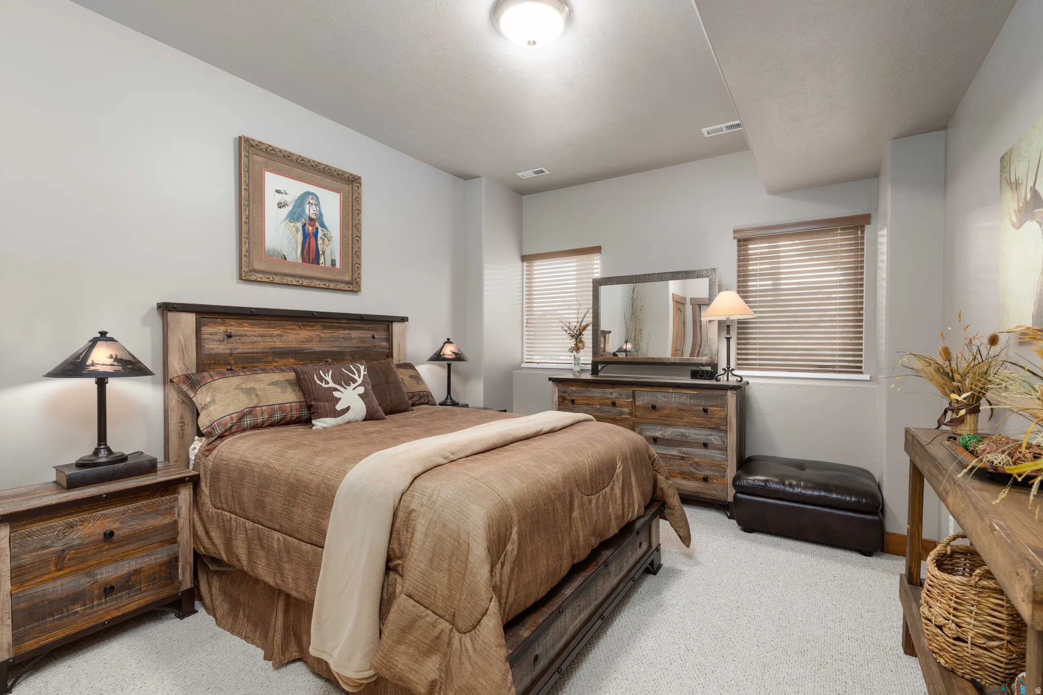 Bedroom with light colored carpet