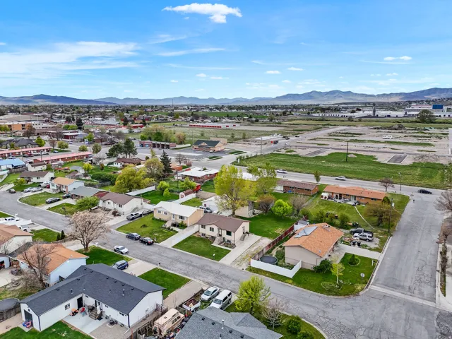 Aerial perspective of suburban area with a mountain backdrop