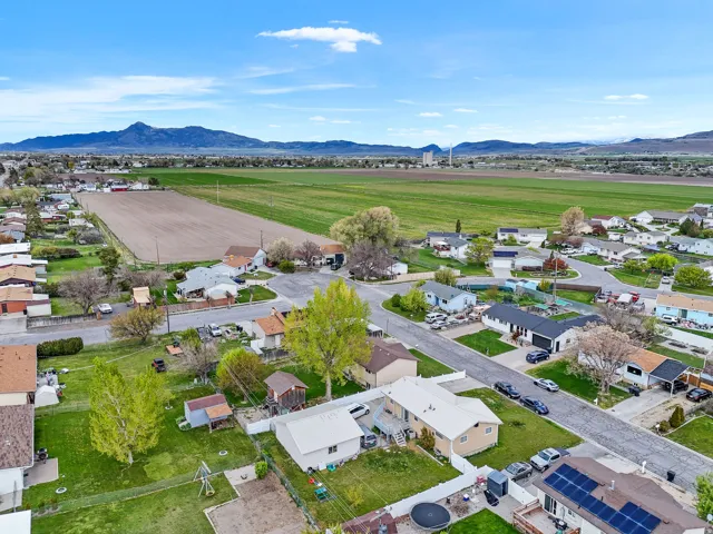 View of rural area with nearby suburban area and mountains